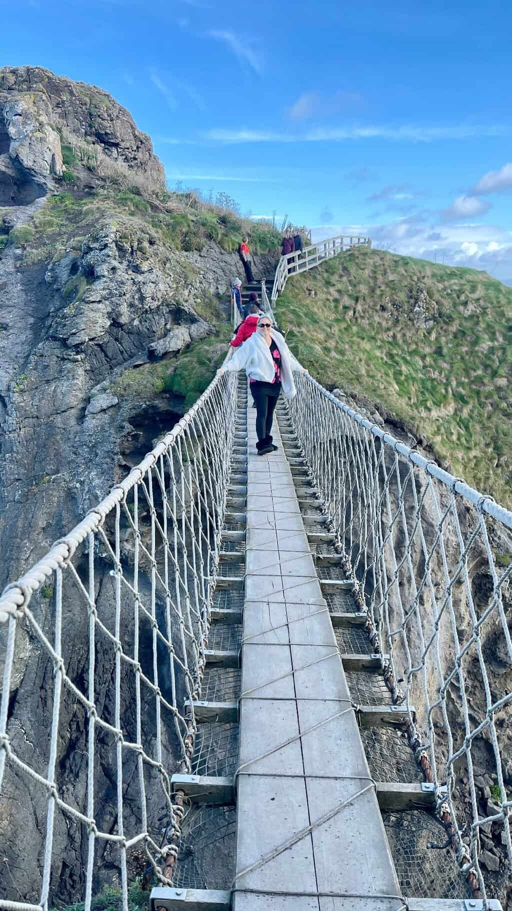 What to see in Northern Ireland- Walk across Carrick-a-Rede Bridge on Ireland's Antrim Coast, UK. #thingstodoinNorthernIreland #NorthernIrelandthingstodo